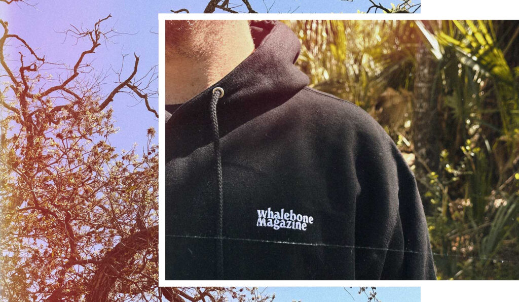 Two images layered over each other. The left a person wearing the black whalebone magazine hoodie in front of a bunch of palmettos. The right image shows the sky and live oak branches. 