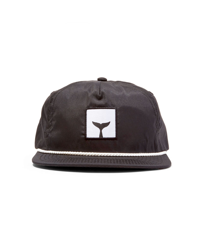 front view of a black whalebone whaletail 5-panel hat 